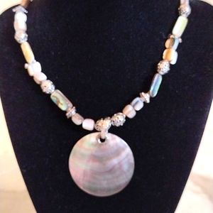 Cookie Lee shell medallion pendant necklace.